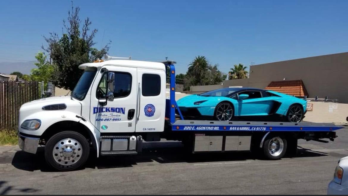 Dickson flatbed transporting a Lamborghini Aventador in San Gabriel