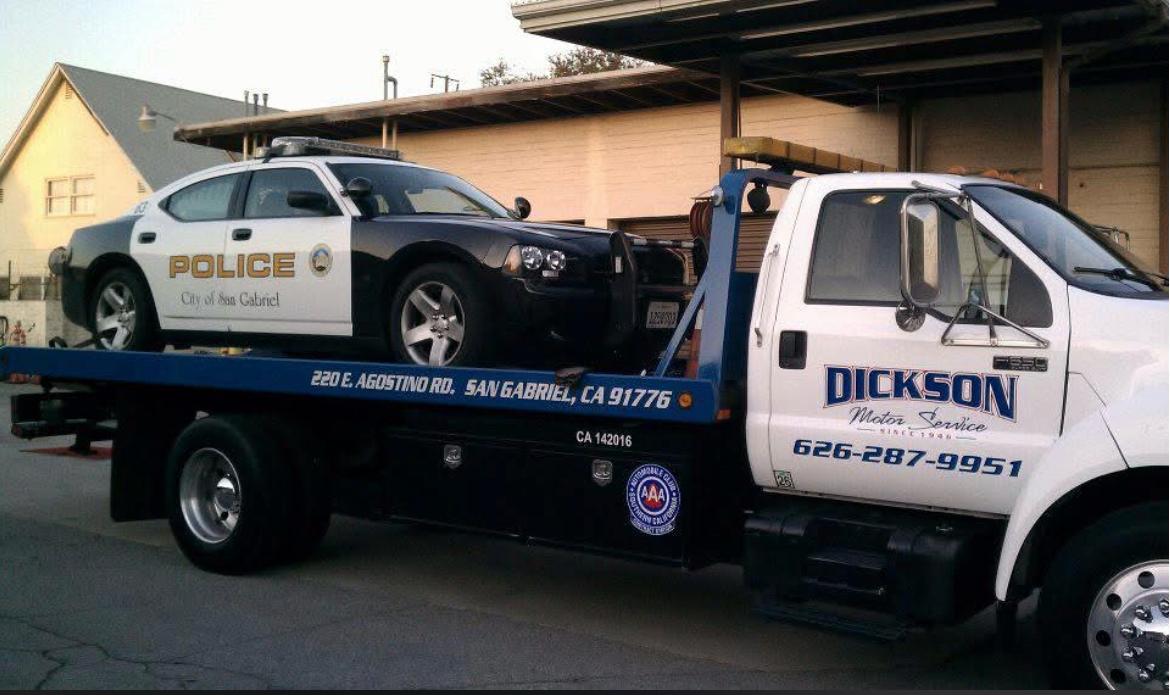 Dickson Motor Service flatbed transporting a San Gabriel Police Department vehicle
