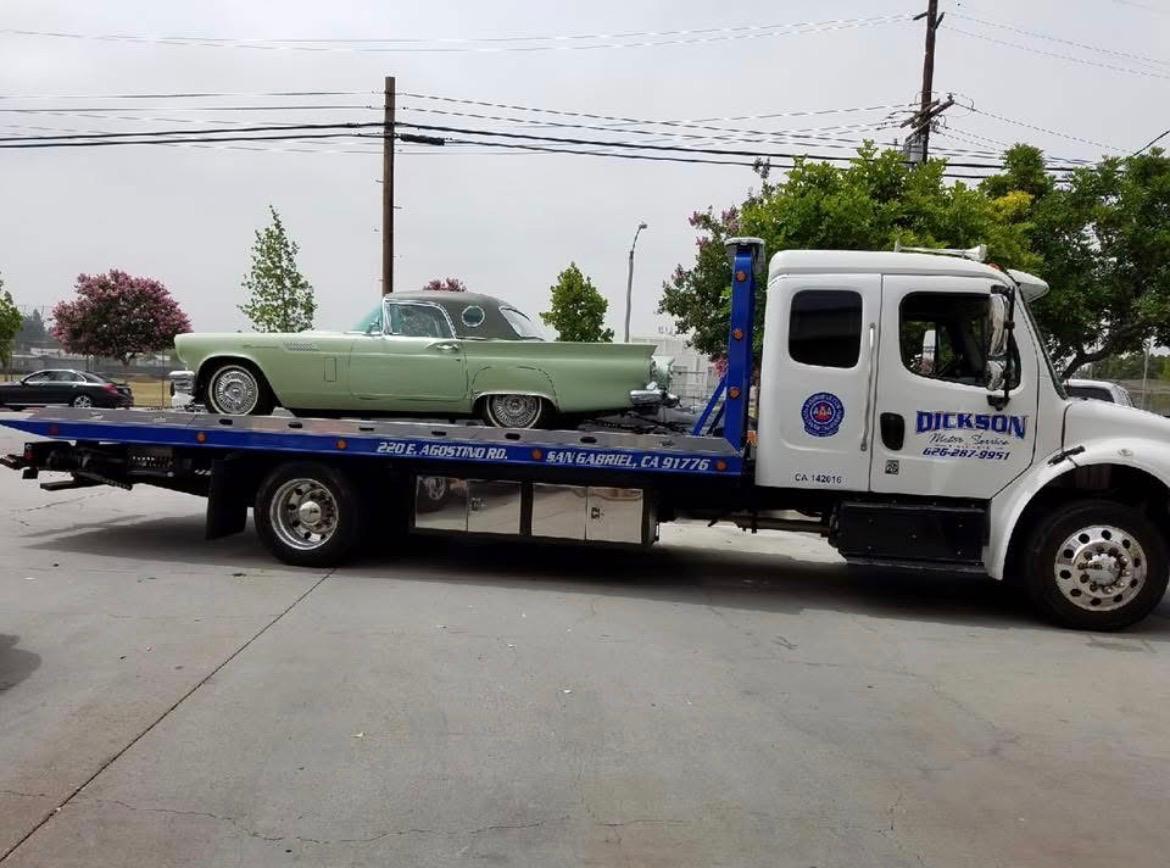 Dickson flatbed transporting a 1957 Ford Thunderbird